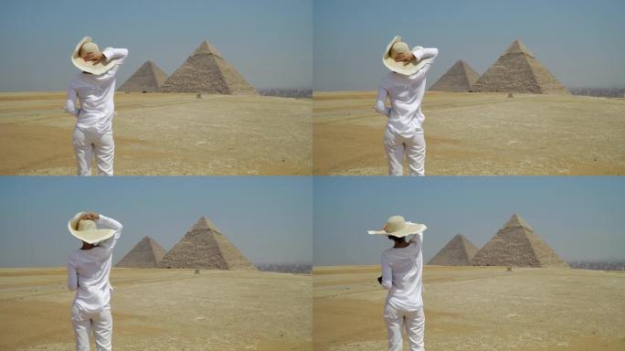 年轻快乐的旅行者凝视着吉萨大金字塔。埃及开罗的帝王谷。