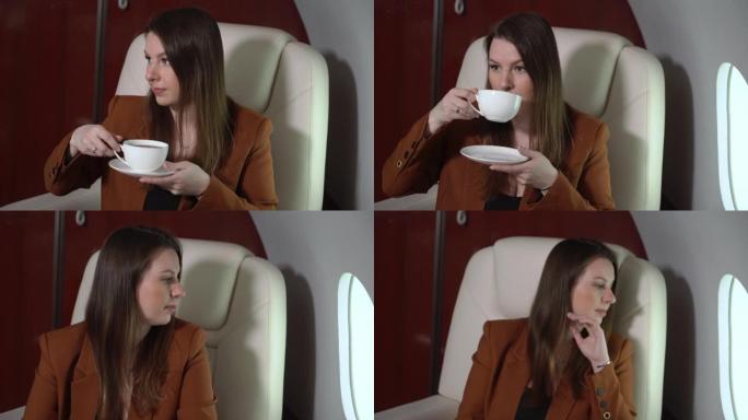 飞机客舱头等舱的女人喝咖啡。私人飞机豪华旅行中的乘客vip