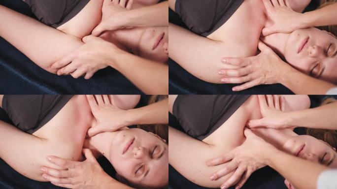 按摩师在临床上对女性颈部和颈部进行中式按摩