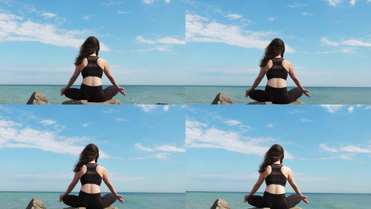 海洋冥想自然瑜伽女人海滩波浪天空