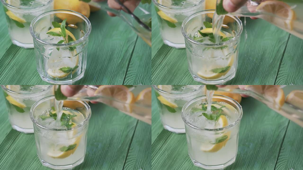 新鲜的冷柠檬水，薄荷和冰，户外拍摄，顶视图。美味的柠檬鸡尾酒。