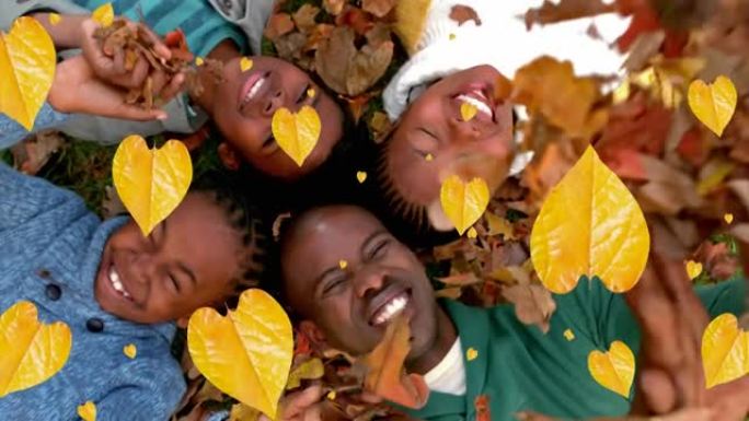 秋叶的动画落在公园里快乐的非洲裔美国人家庭上