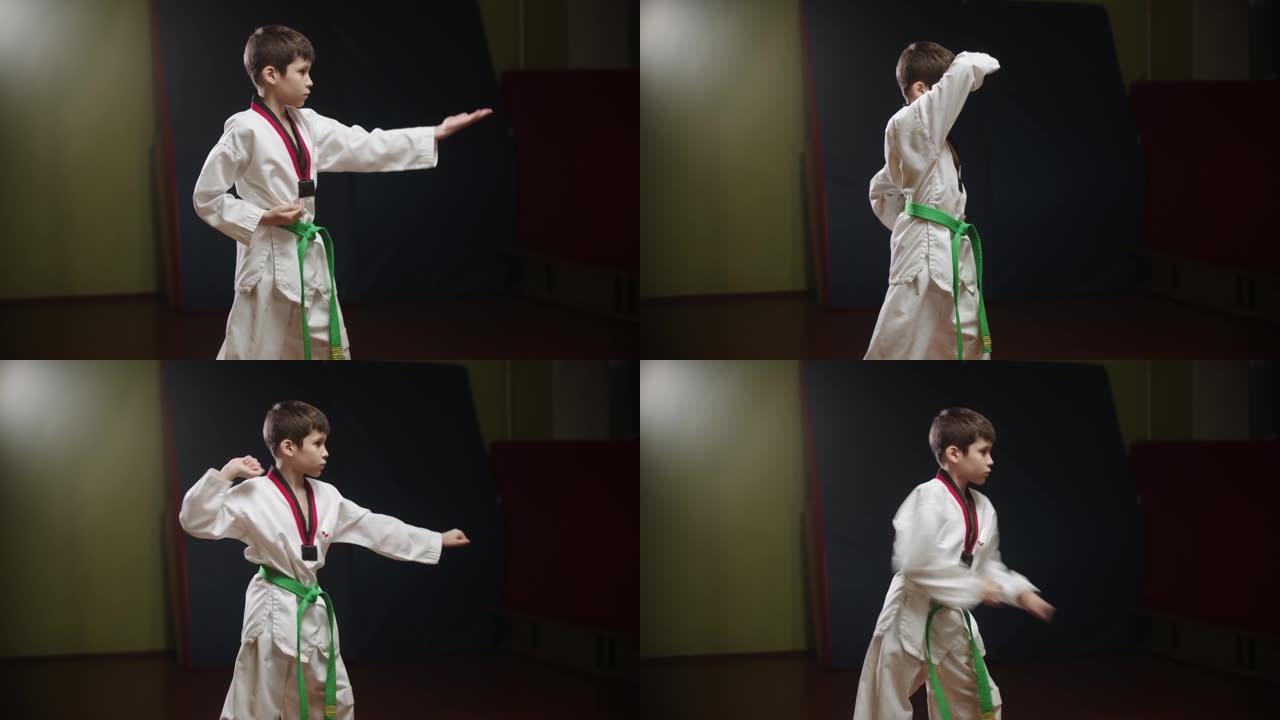 一个做跆拳道的小男孩-站着姿势并用手臂展示动作