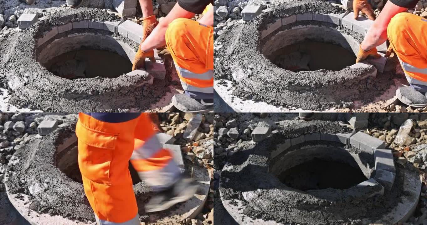 公用事业工人安装地下人孔污水的污水处理工程
