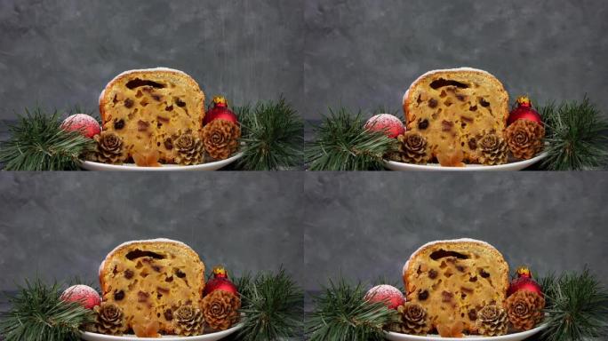 糖粉倒在深色背景的圣诞水果蛋糕上。节日糕点烘焙。斯托伦面团配方配料坚果香料干蜜饯鸡蛋全麦面粉干水果黄