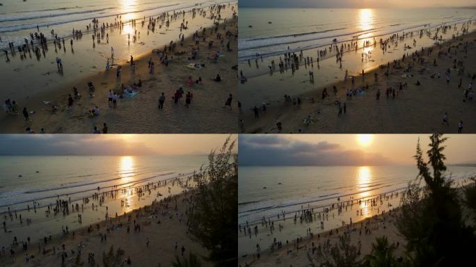 海南省三亚市三亚湾耶梦长廊沙滩的旅游游客