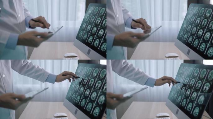 医生通过数字平板电脑对患者进行脑部扫描进行分析