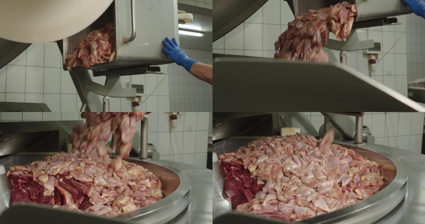 在大型绞肉机中，用鸡肉研磨肉。香肠的生产