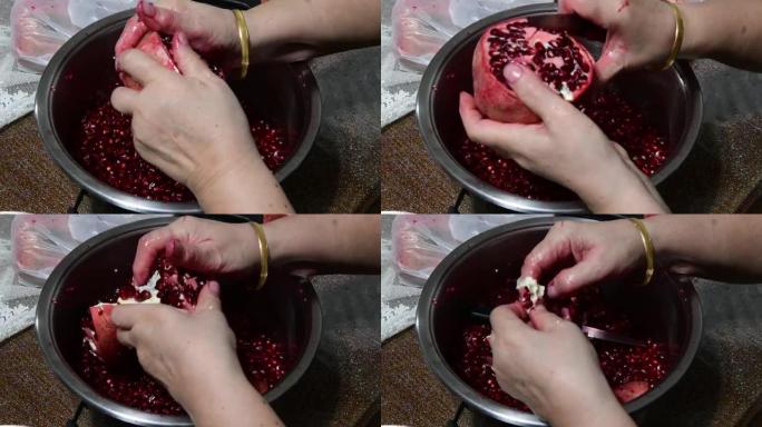 女性的手正在剥石榴以将果皮用作食物