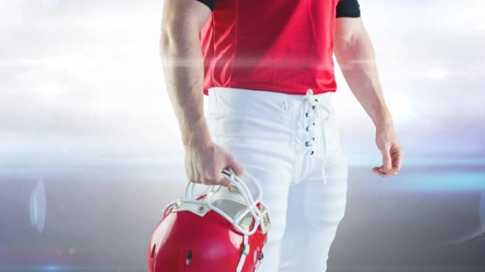 在泛光灯体育场手持头盔的男子美式足球运动员的动画中段