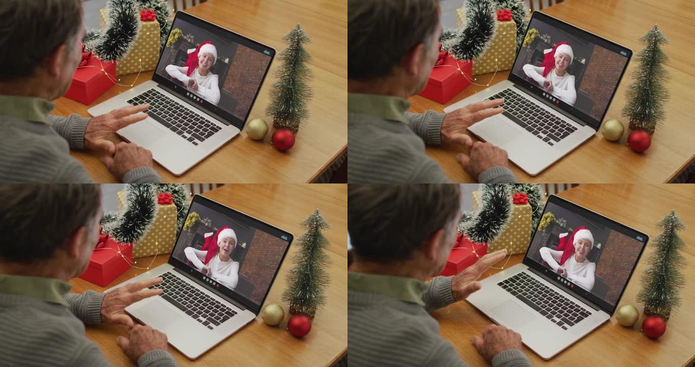 圣诞节时，白人高级男子与成年女儿进行视频通话