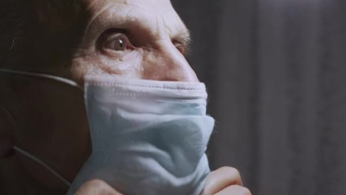 生病的成熟患者戴着医用口罩关闭侧视图。