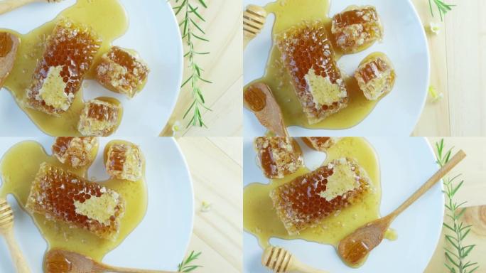 木质背景上白色盘子的甜蜂窝，木质背景上黄色蜂窝。