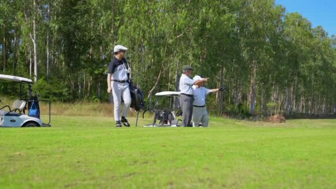 4k亚洲人民高尔夫球手在乡村俱乐部一起打高尔夫球。