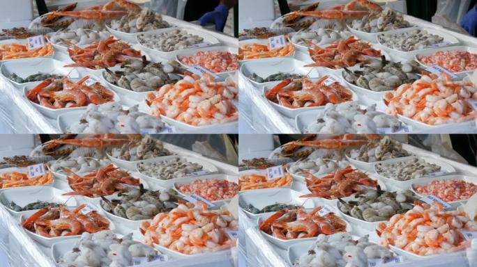 杂货市场柜台上的各种海鲜。各种带有德国价格标签的虾、章鱼、龙虾