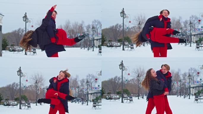 年轻的家庭男孩和女孩在下雪天在公园里度过一天。情绪化的年轻夫妇在冬季城市散步时玩得开心，一个活泼的男