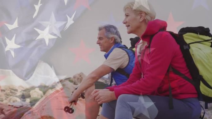 美国国旗在老年夫妇在山中远足休息的动画