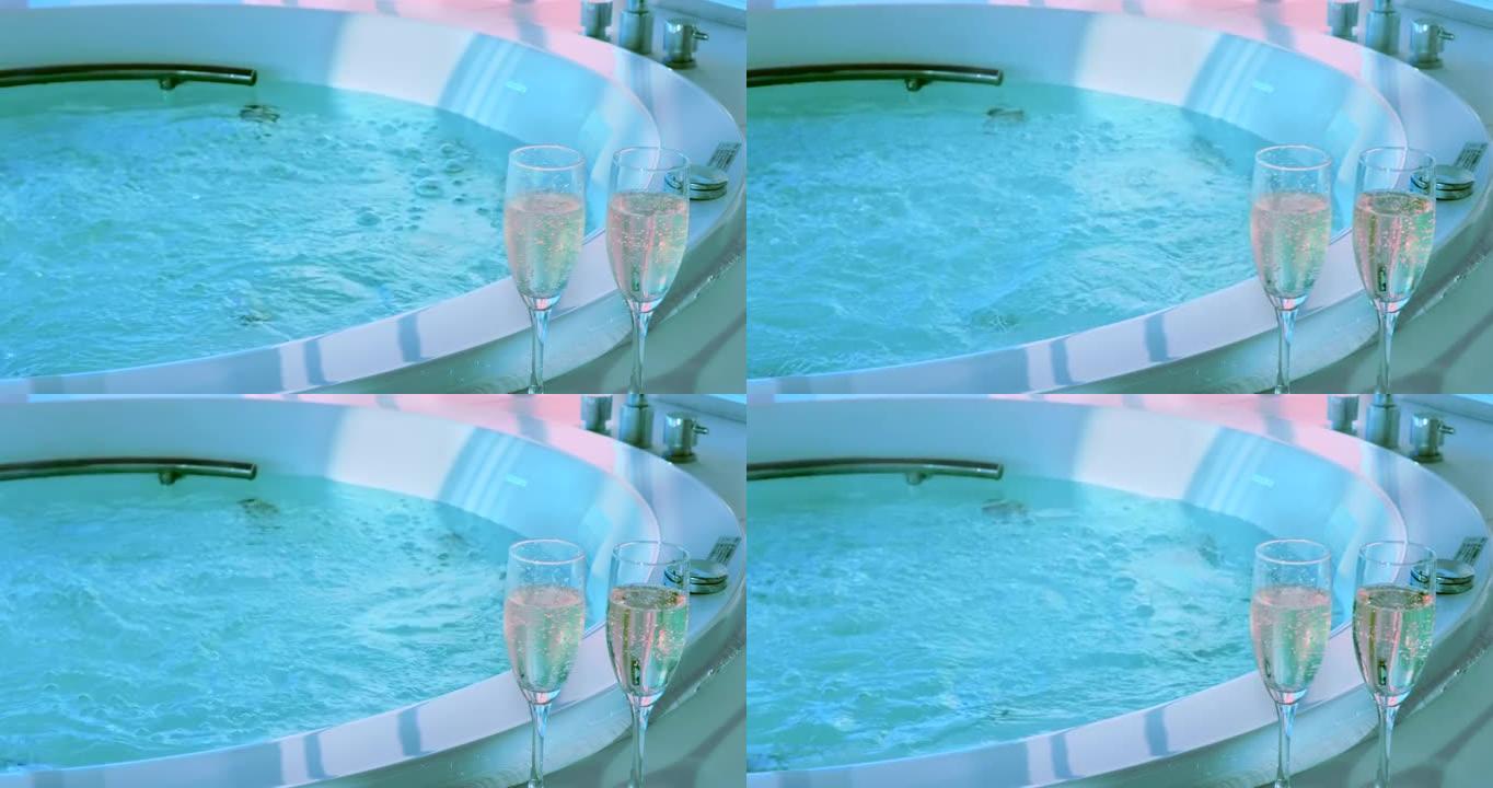 美味的香槟和放松的热水浴缸