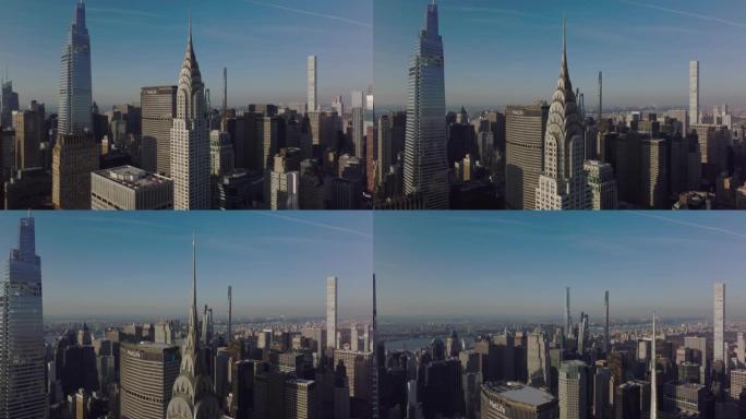 飞来飞去克莱斯勒大厦美丽的顶部。周围高层办公大楼的鸟瞰图。美国纽约市曼哈顿