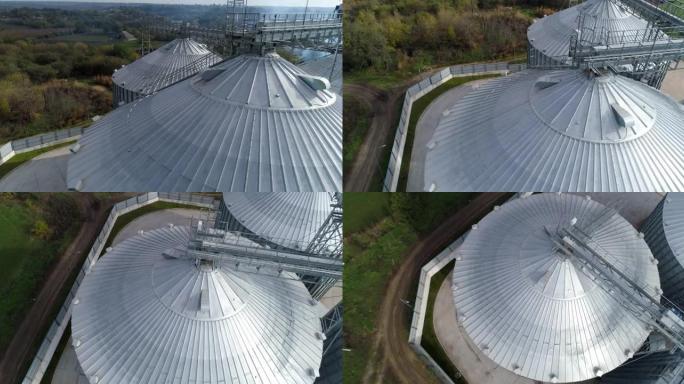 谷物升降机顶部的金属结构。现代农产品储藏工业。农业综合企业的银仓。俯视图。