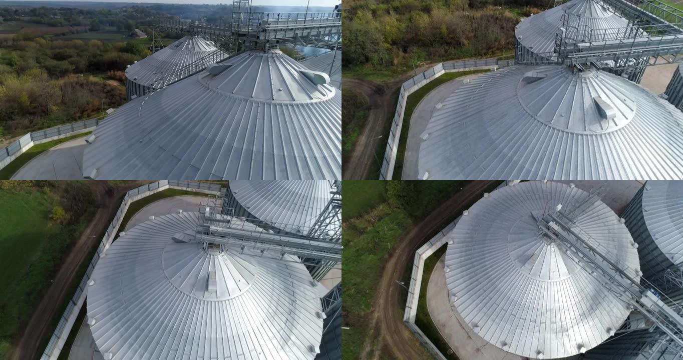 谷物升降机顶部的金属结构。现代农产品储藏工业。农业综合企业的银仓。俯视图。