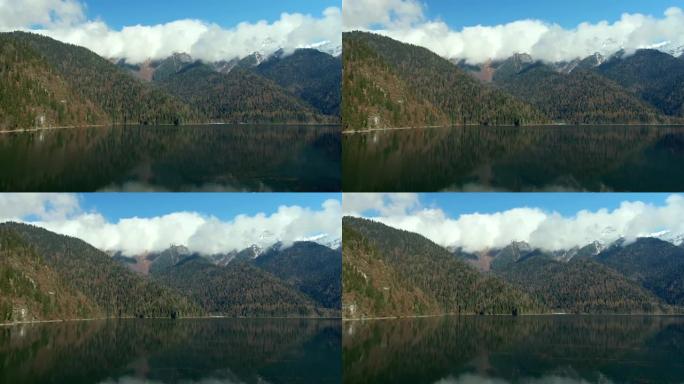鸟瞰图美丽多彩的风景森林中的山湖。平静的绿松石水中山峰的反射