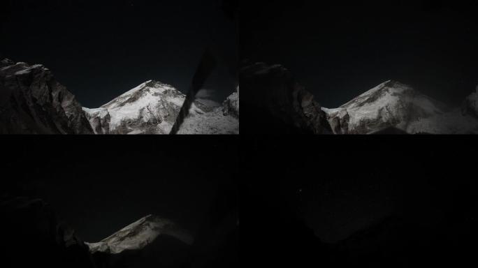 令人敬畏的延时。黑暗阴影覆盖大雪峰。高地的夜晚来了
