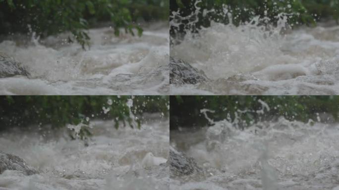 暴雨浸湿了河岸上的植被后，在山河动荡的水流中，充满气泡和飞溅的水流在岩石上跳跃37