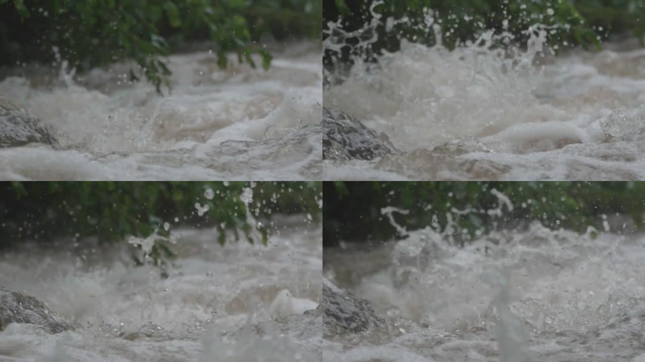 暴雨浸湿了河岸上的植被后，在山河动荡的水流中，充满气泡和飞溅的水流在岩石上跳跃37