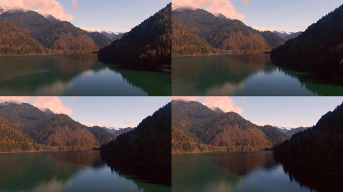 鸟瞰图美丽多彩的风景森林中的山湖。平静的绿松石水中山峰的反射