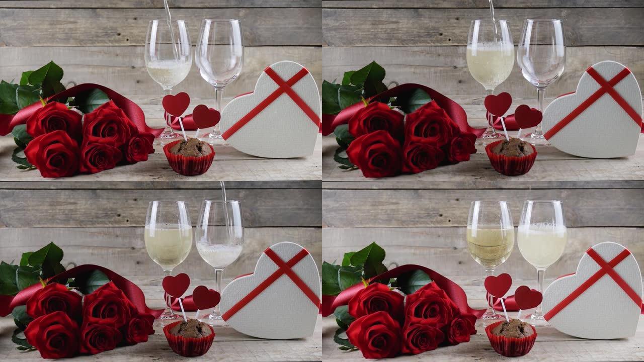 情人节。两杯香槟，红玫瑰，木制背景上的心形盒子。香槟倒了。情人节。文本的位置