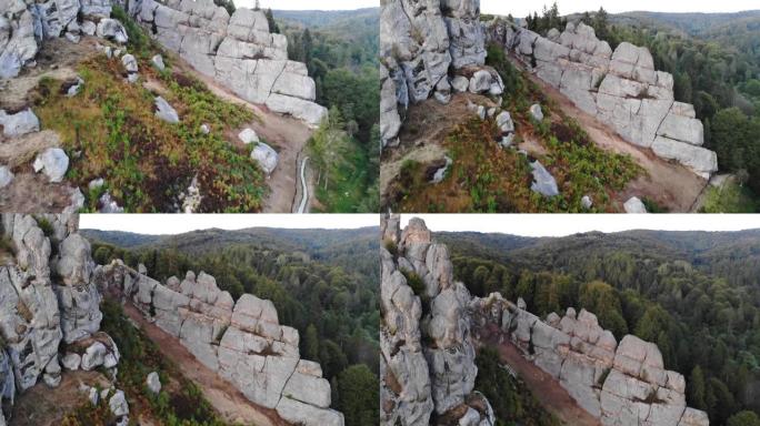 空中无人机镜头在著名的图斯坦要塞的岩石附近飞行。国家公园的乌克兰中世纪悬崖边纪念碑。图斯坦的岩石综合