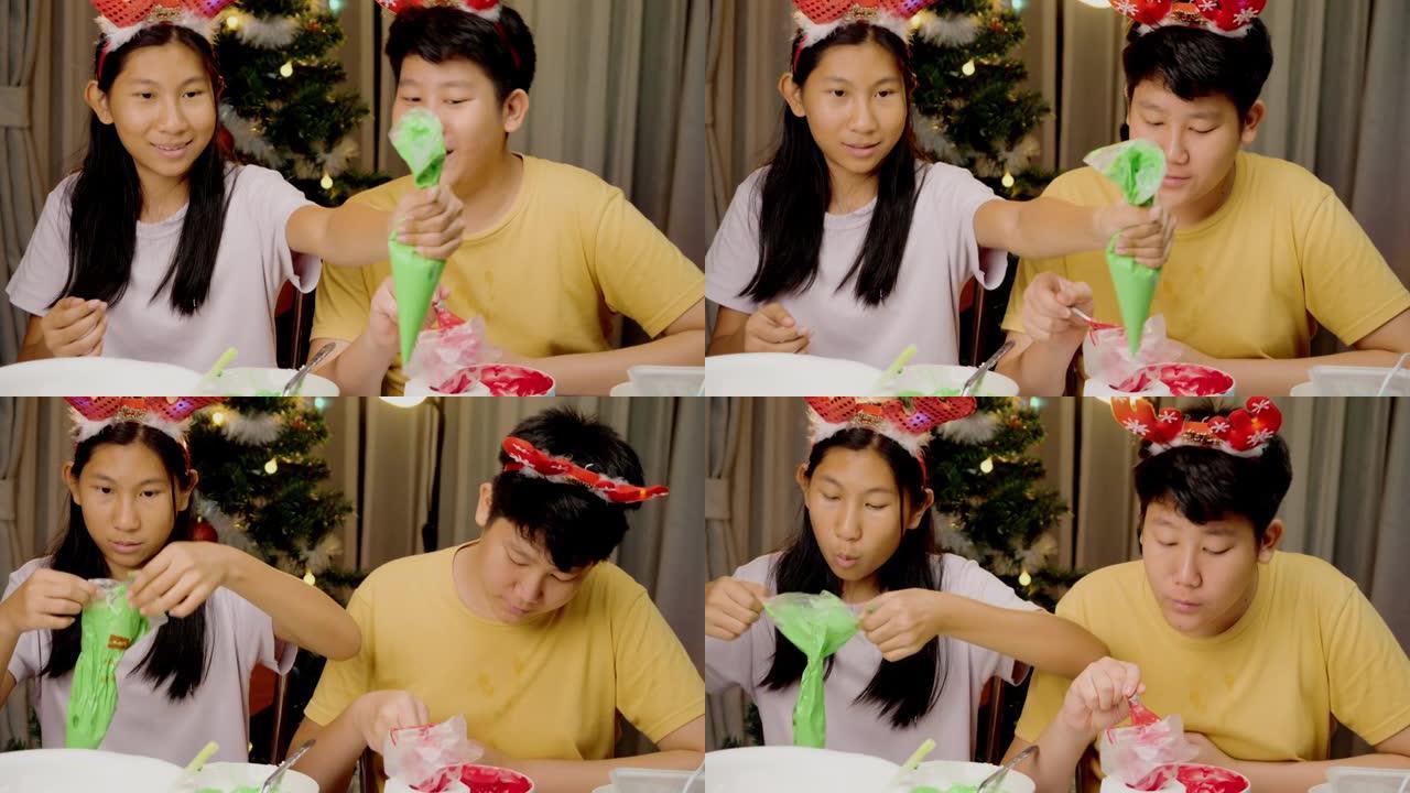 亚洲儿童准备皇家糖衣管道袋，用于装饰圣诞饼干，节日庆祝生活方式概念。