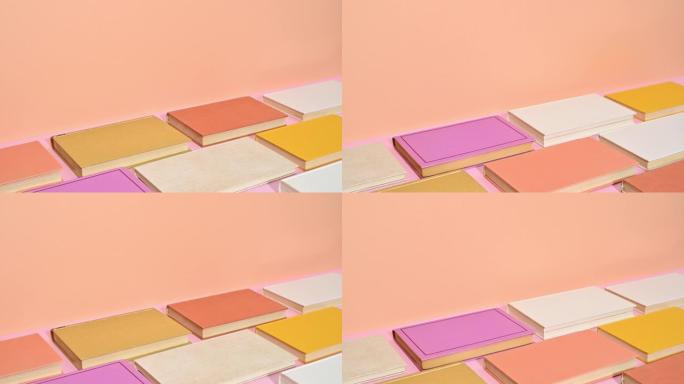 一堆粉彩精装书，改变橙色主题的位置。停止运动
