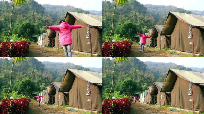 印度北阿坎德邦瑞诗凯诗野营帐篷附近的跑步女孩