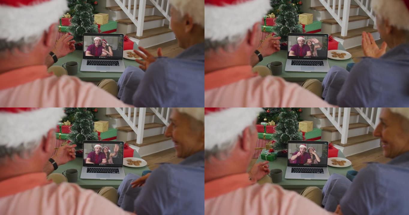 快乐的高加索高级夫妇在圣诞节与家人进行视频通话