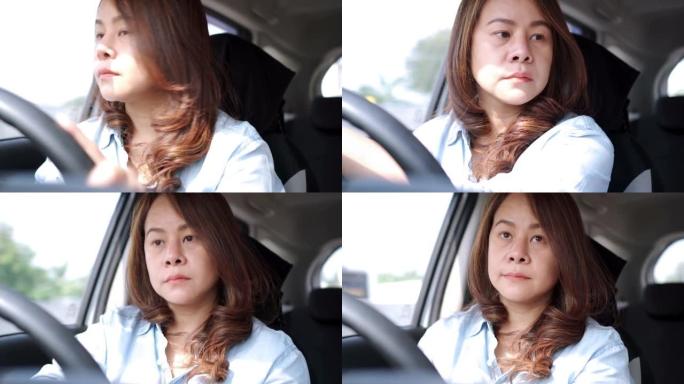 疲倦困倦的年轻女子在车内交通中打哈欠