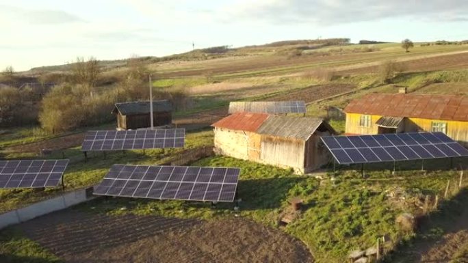 绿色乡村庭院太阳能电池板的空中俯视图。