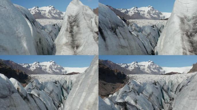 鸟眼无人机飞过冰岛Breidamerkurjokull冰川舌头的破裂冰块地层。冰山漂浮的惊人鸟瞰图。