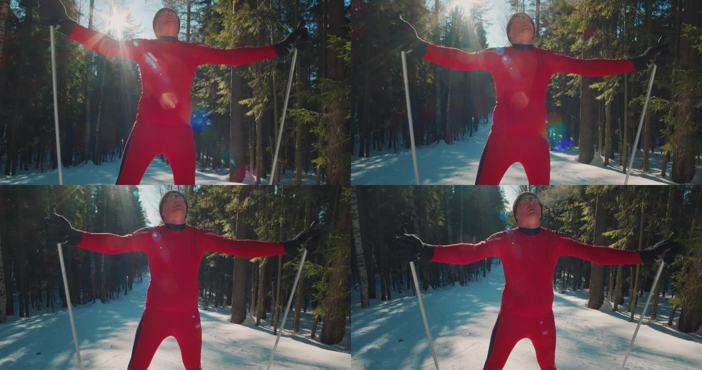 在公园滑雪。穿着红色西装的成年男子站在阳光明媚的公园里呼吸。业余滑雪者在公园锻炼