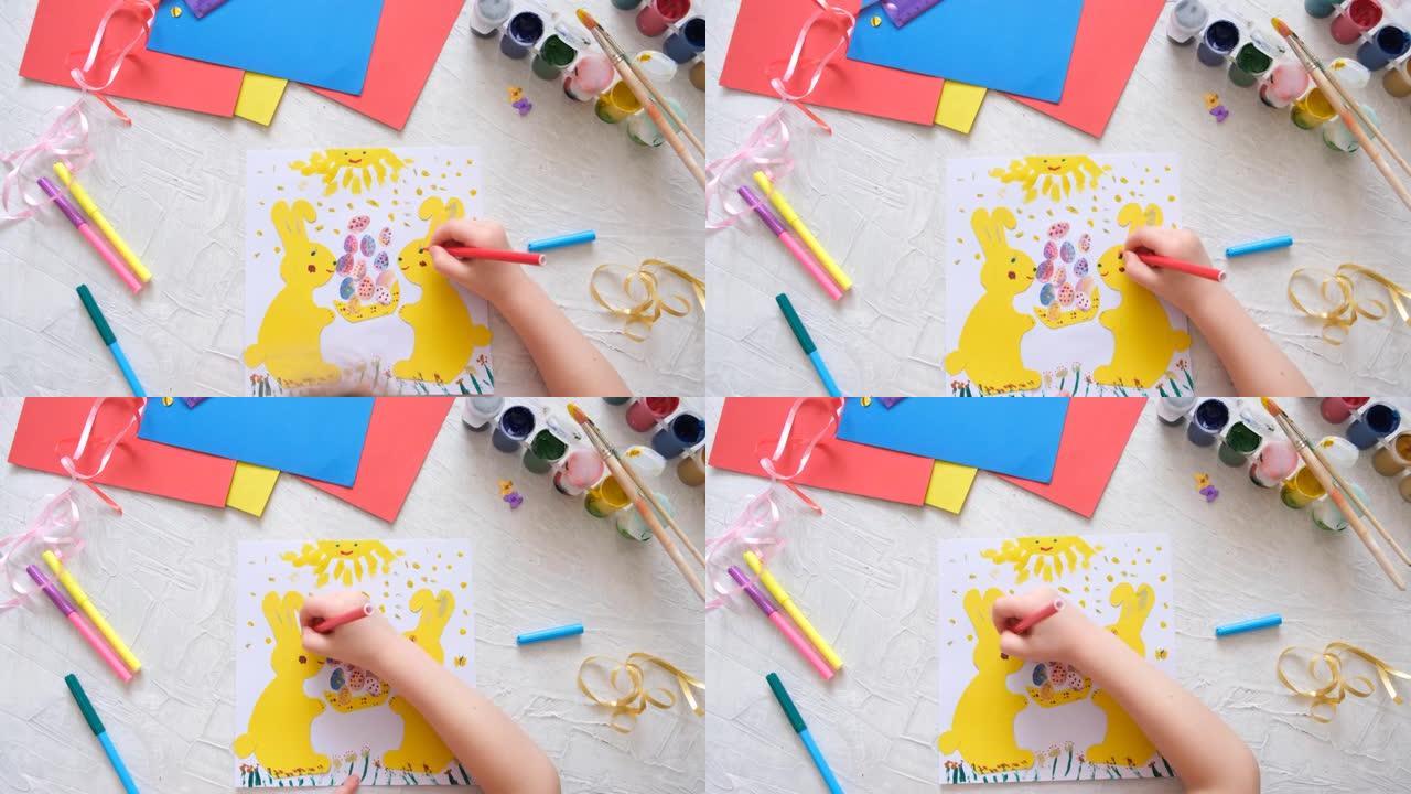 小朋友用彩色的纸制作复活节兔子卡片。贴花。手工制作的。儿童创意项目，手工艺品，儿童工艺品。