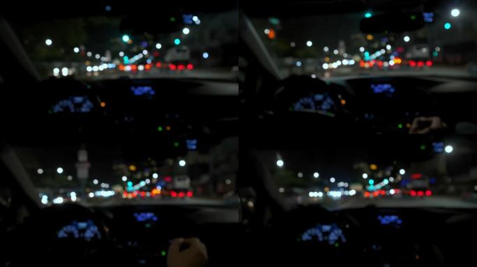 夜路模糊的视野和过往汽车的眩光。慢速镜头