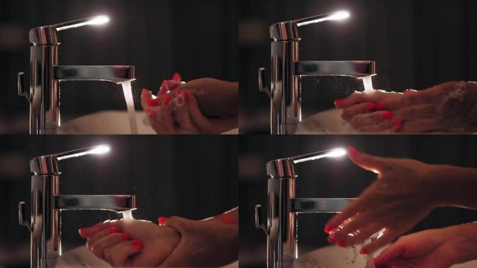 洗手。特写。鲜红色修指甲的女性手。女人洗手