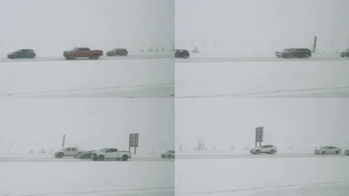 暴风雪，在高速公路上能见度差，道路湿滑，交通繁忙。冬天在暴风雪中行驶的汽车。