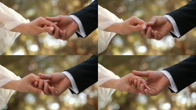 年轻夫妇牵着手慢动作观看细节。婚礼框架