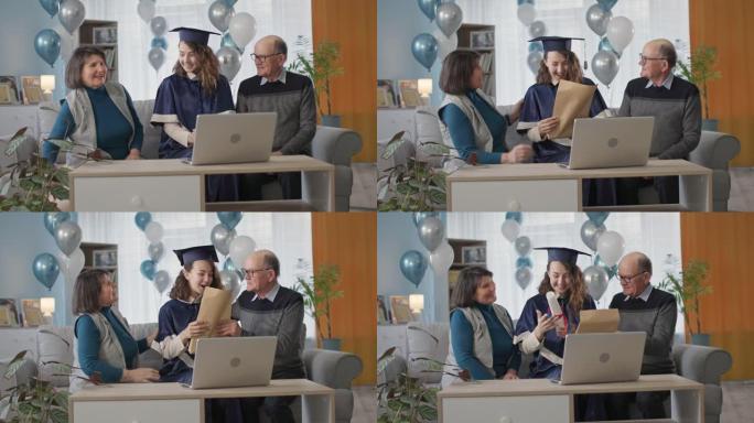 高中毕业，快乐的父母祝贺女毕业生毕业，并在一个在线仪式上向她颁发文凭，她坐在家里的客厅里，拿着气球