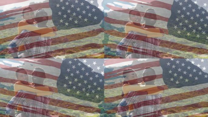 美国国旗的动画在山上拥抱着微笑的多样化夫妇
