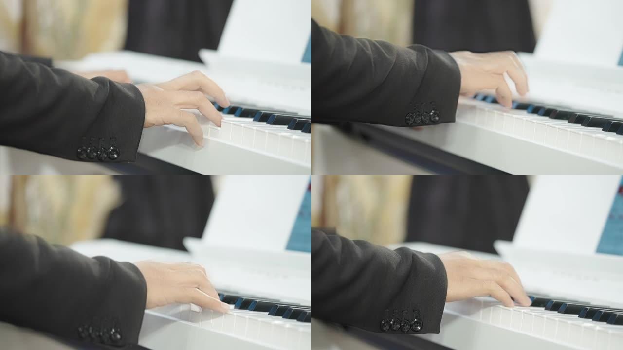 特写男人的手弹钢琴