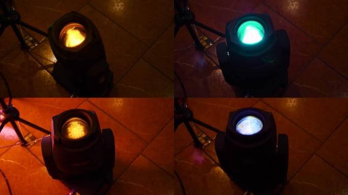 用彩色自动旋转RGB投影仪发光二极管在黑暗中发光。夜总会照明设备镜头