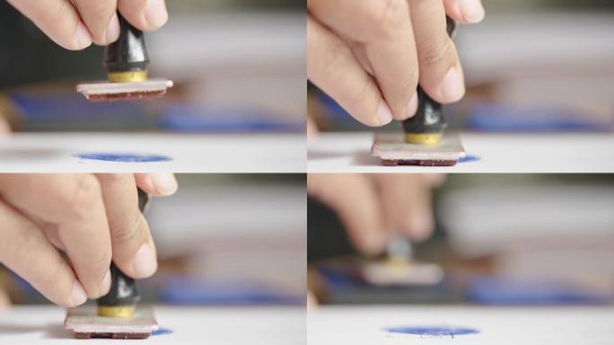 官员在批准文件上盖章。合同文件的批准